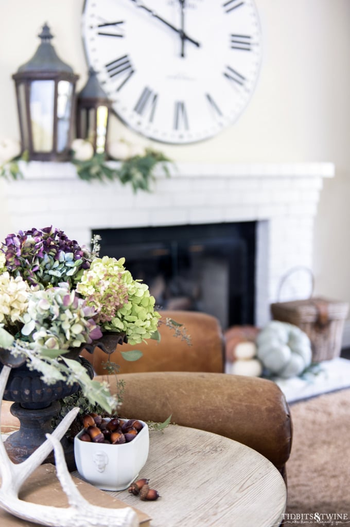 Side table with dried hydrangeas acorns and antler in fall family room