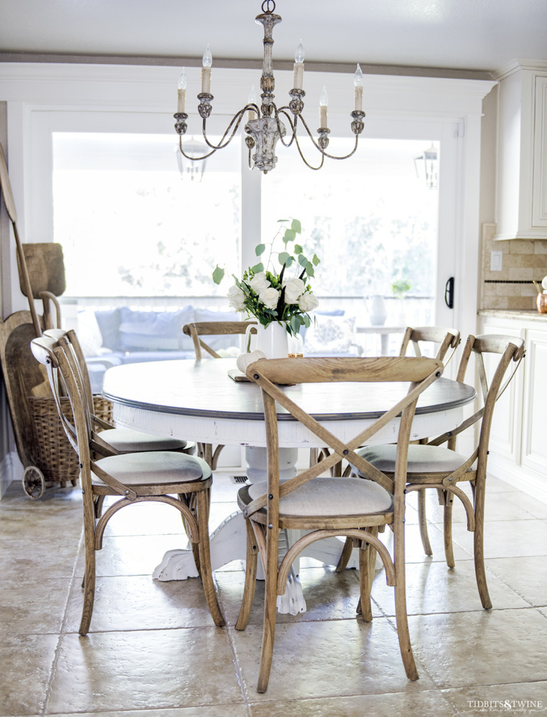 French farmhouse kitchen table with crossback chairs decorated for Fall