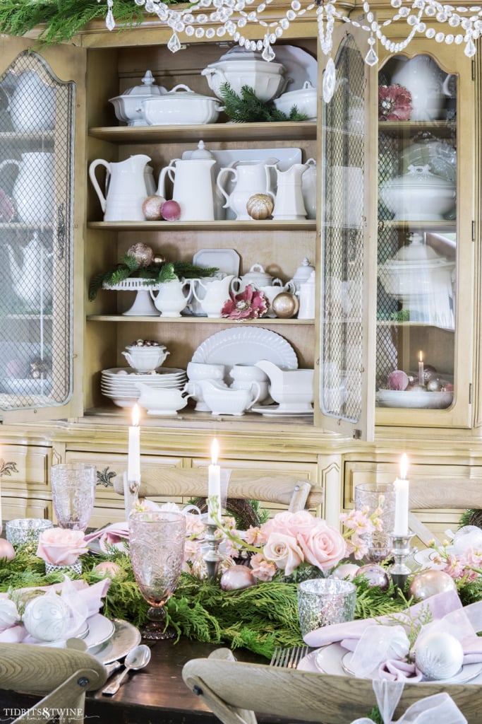 Pink and silver Christmas dining room table with hutch with ironstone collection