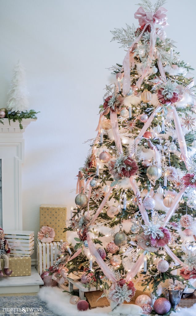 French living room with a Christmas tree decorated with pink silver gold and white