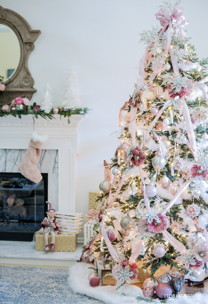 French living room with a pink Christmas tree with crisscross ribbon