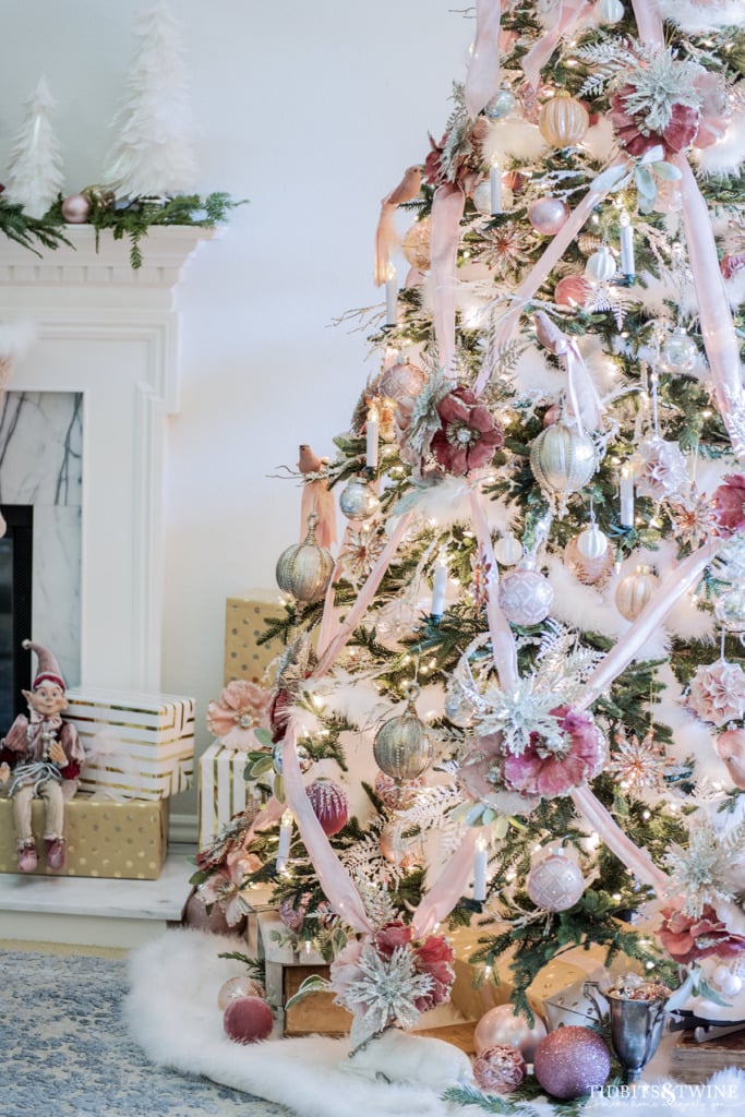 Vintage pink Christmas tree with velvet ribbon and flowers