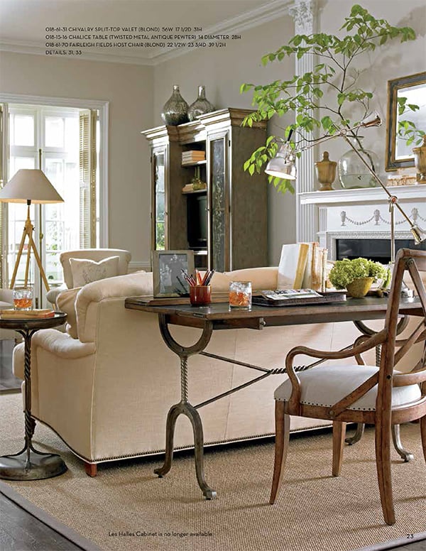 Traditional living room with console table behind sofa that is used as a desk