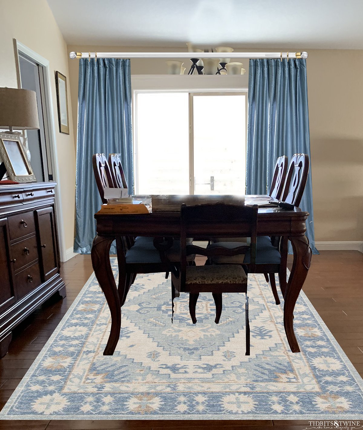 Traditional dining room dark queen anne dining table with blue silk curtains and blue contemporary rug