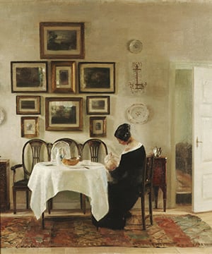 Carl Holsoe art of woman sitting at dining table with baby and wall of artwork