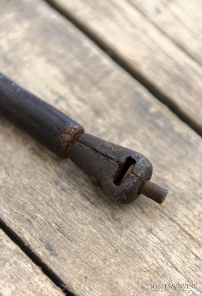 closeup of end of cap gun gadget cane showing the mechanism