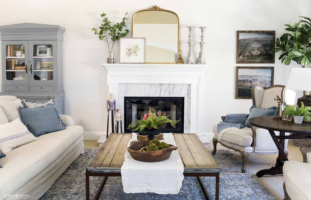 French blue and white living room with fireplace decorated for spring