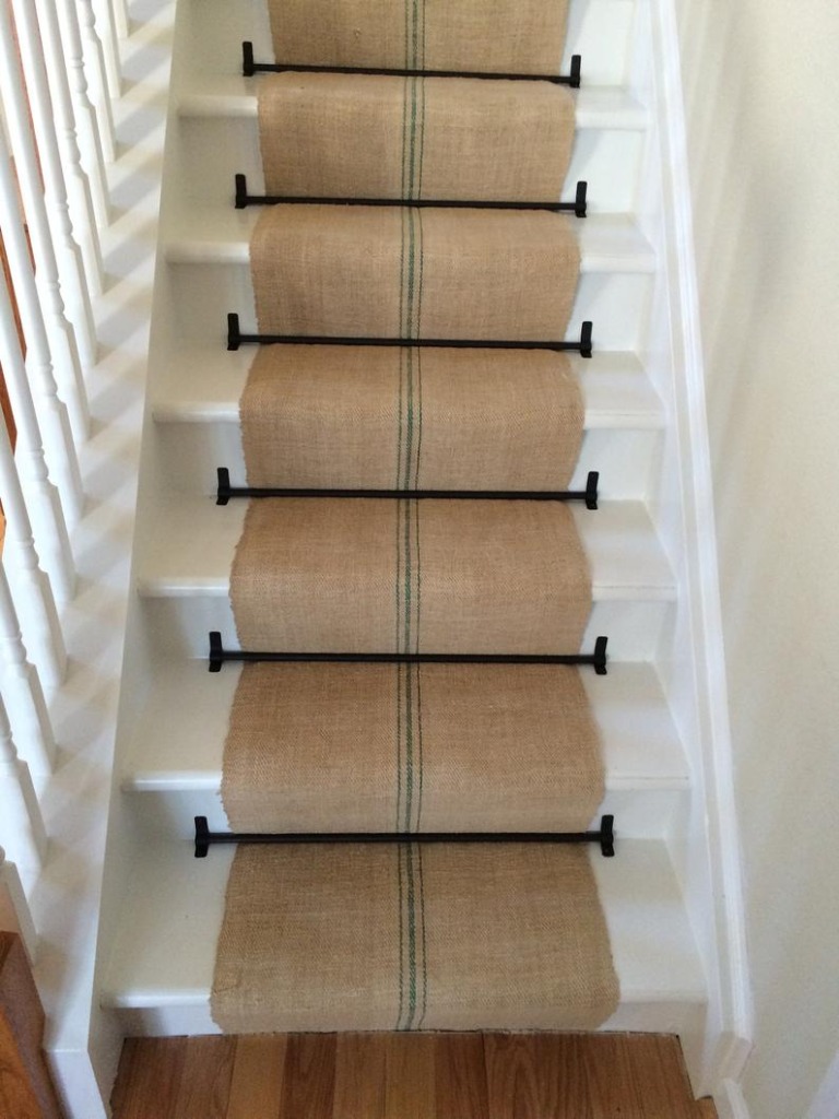 A gorgeous green stripe vintage grain sack stair runner on white stairs