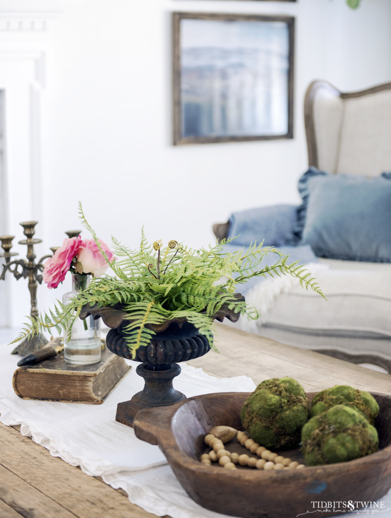 Industrial coffee table in french living room with greenery and flowers decorated for spring