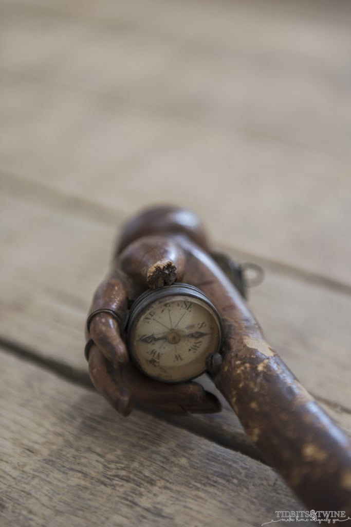 wooden hand cane handle that holds an antique compass