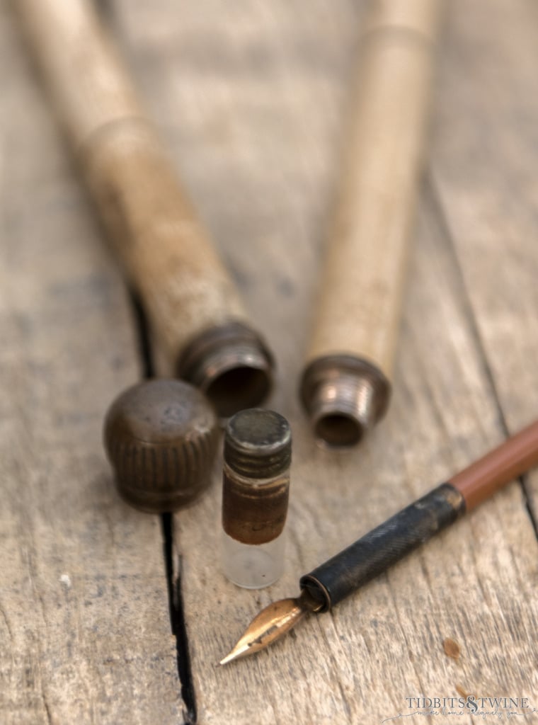 antique gadget cane that unscrews to reveal a glass bottle for ink and a fountain pen