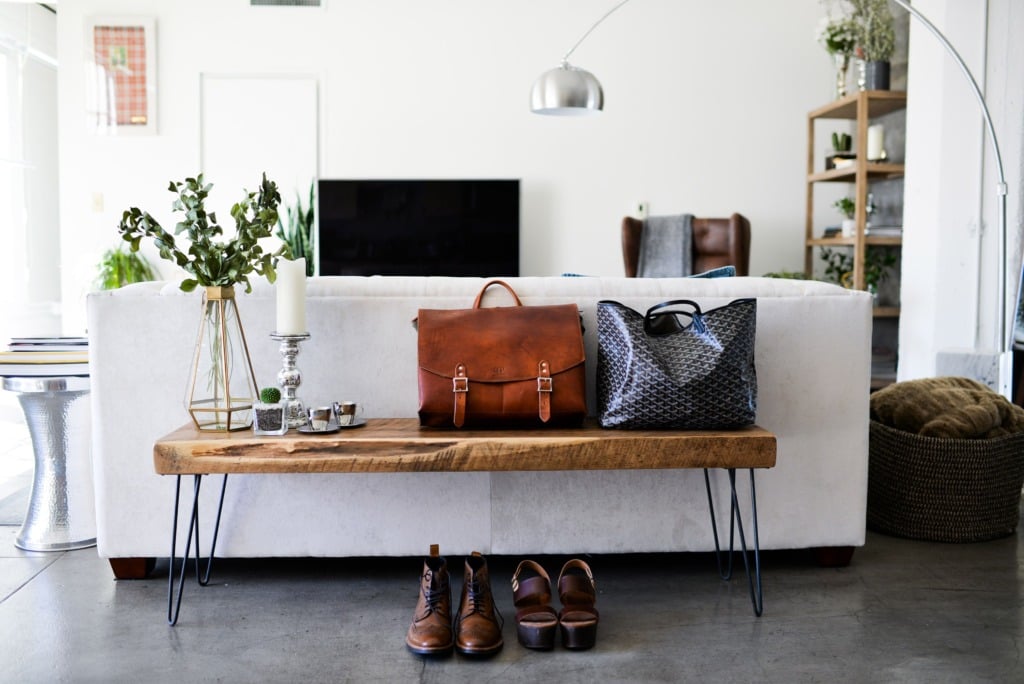 wood bench with hairpin legs behind a sofa in modern living room