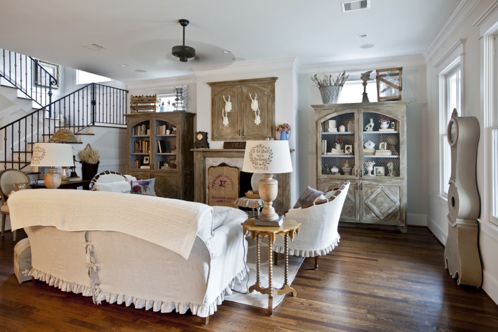 french living room with slipcovered sofa with ruffles and lace up back