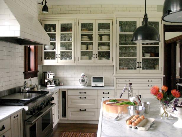 kitchen with white cabinets and black hardware subway tile backsplash