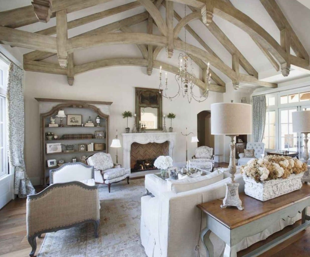 french living room with vaulted ceiling with beams