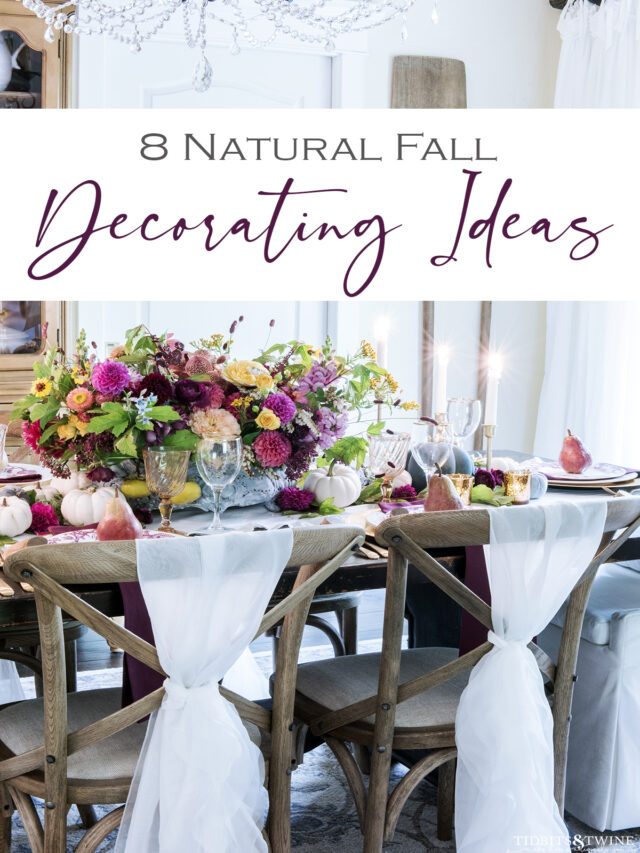 french dining room with brown cross back chairs and pink purple yellow and green flower arrangement in center