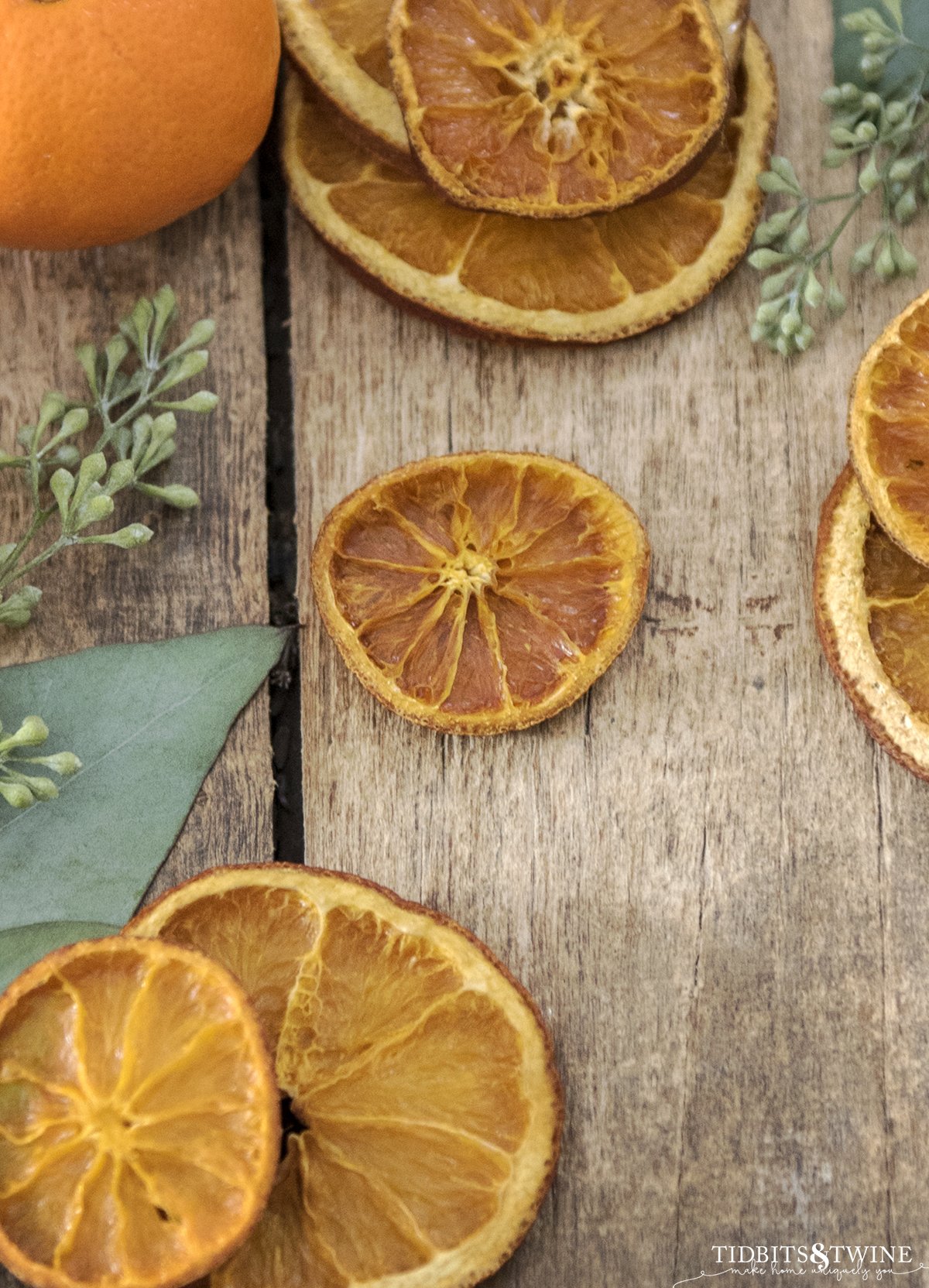 closeup of dried orange slices on a rustic table