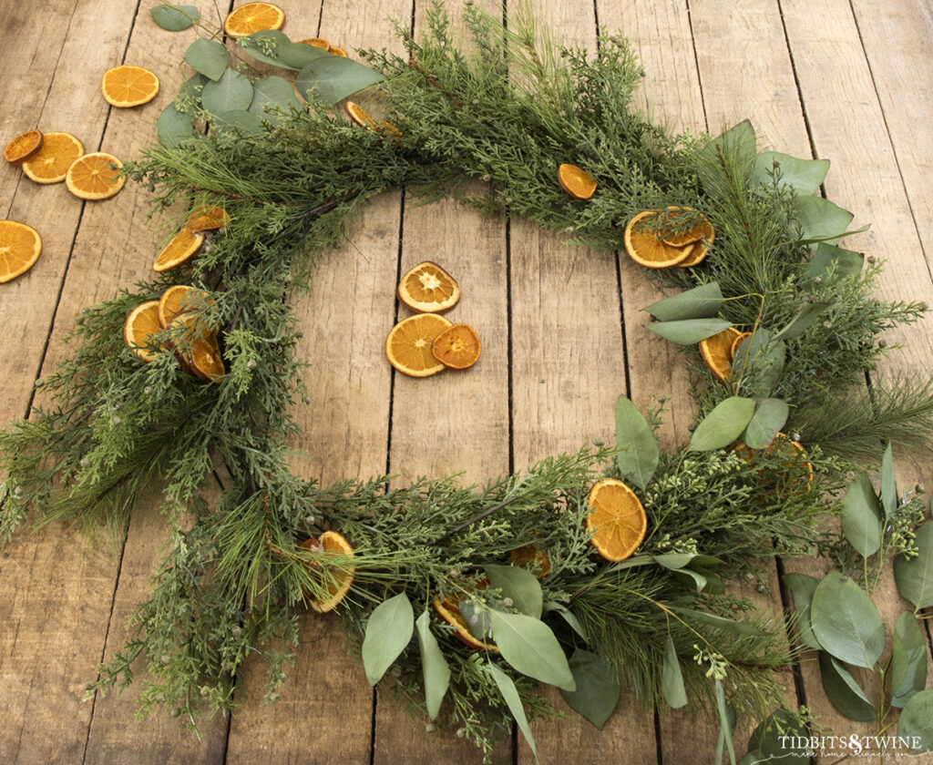 diy christmas wreath with greenery dried oranges and eucalyptus leaves