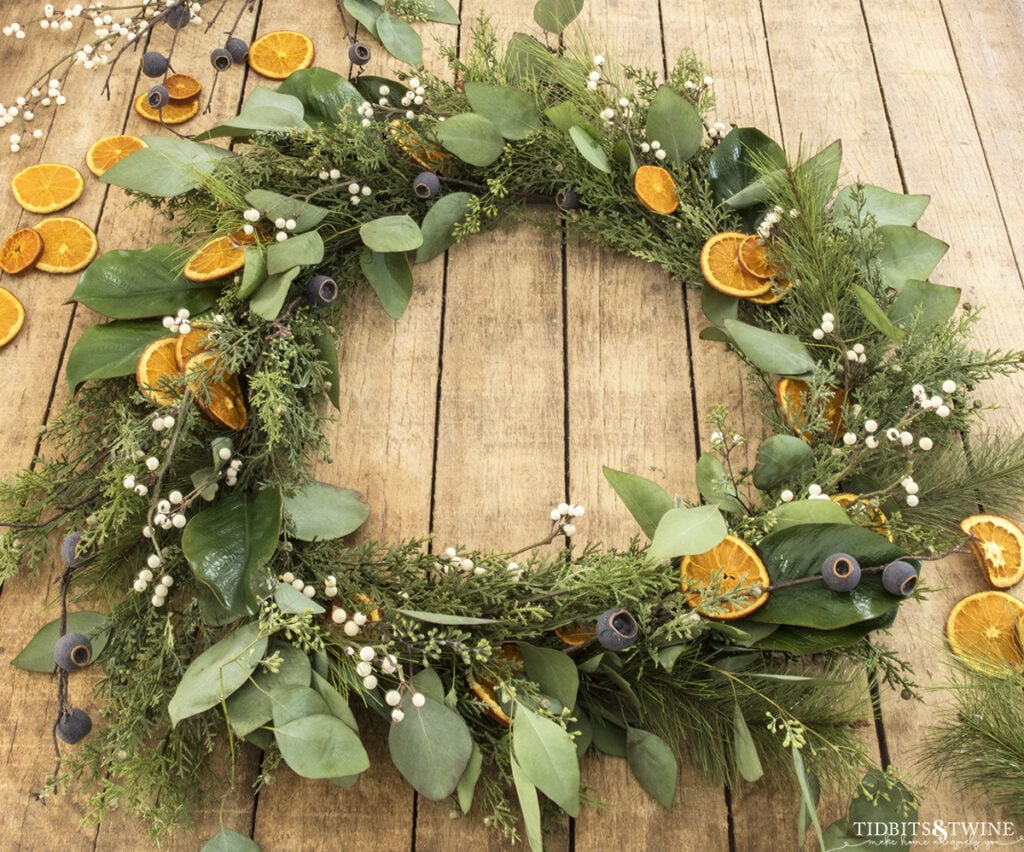 diy christmas wreath with greenery dried oranges and eucalyptus leaves