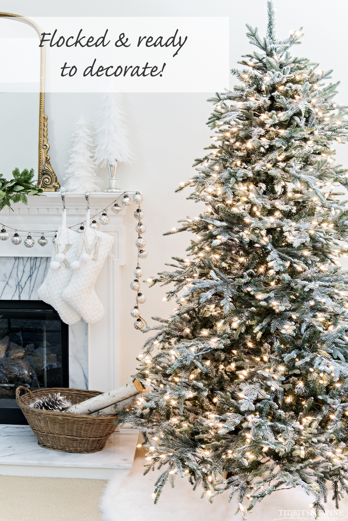 lightly flocked christmas tree ready to decorate next to fireplace in living room