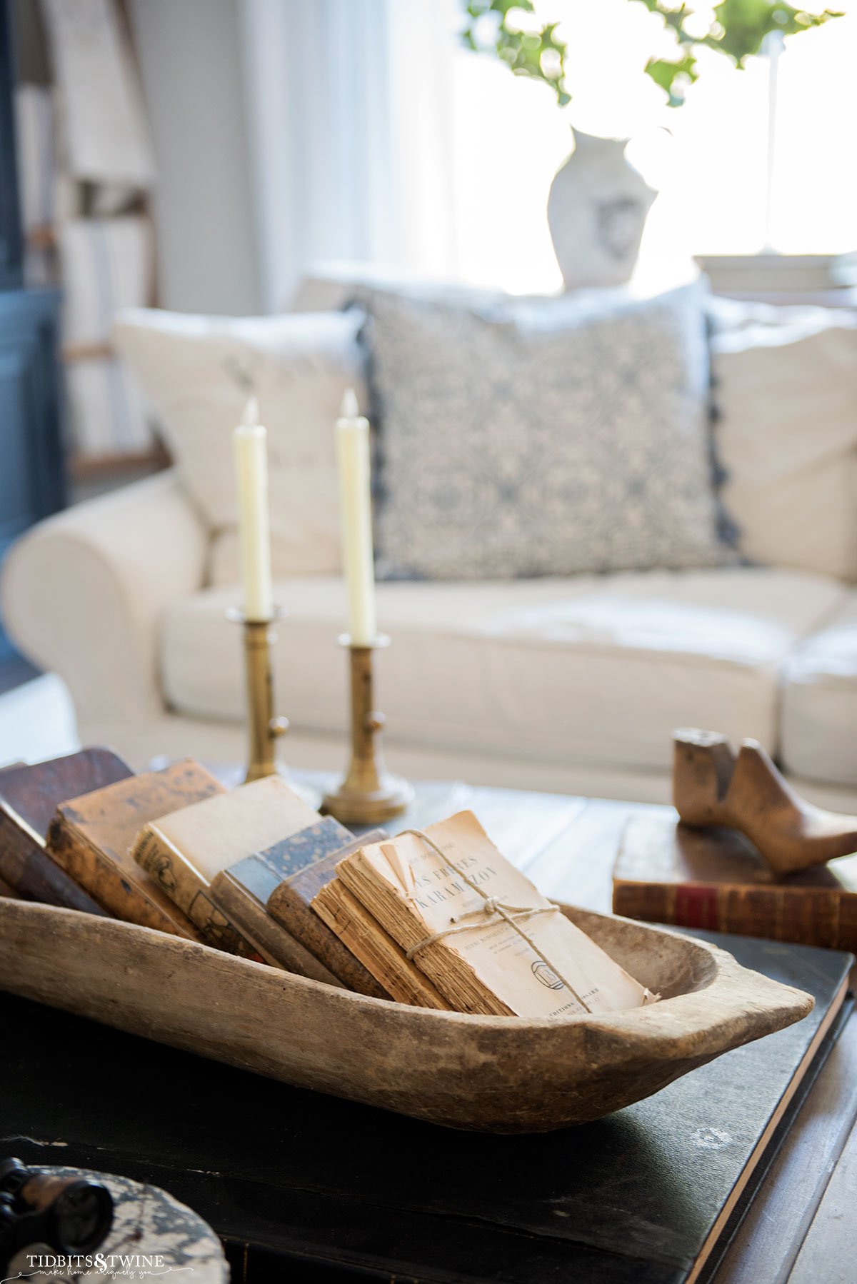 https://www.tidbitsandtwine.com/wp-content/uploads/2022/02/Books-in-Dough-Bowl-on-Coffee-Table.jpg