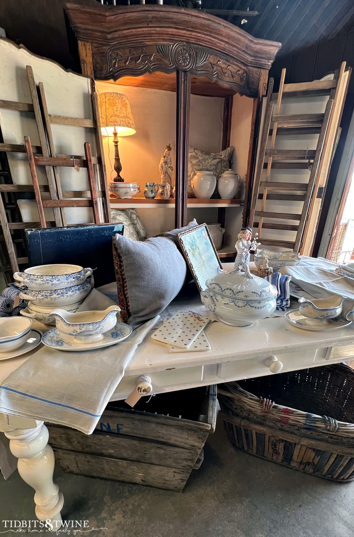French antiques on a table with an old armoire in background