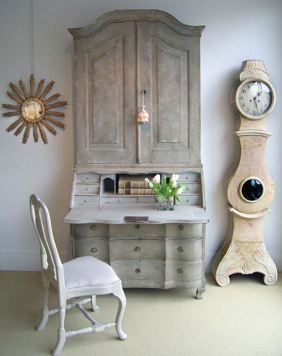gray gustavian secretary desk open with tulips on top and mora clock on the side