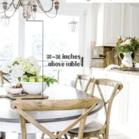 kitchen table with bowl of green apples and white hydrangeas in the center