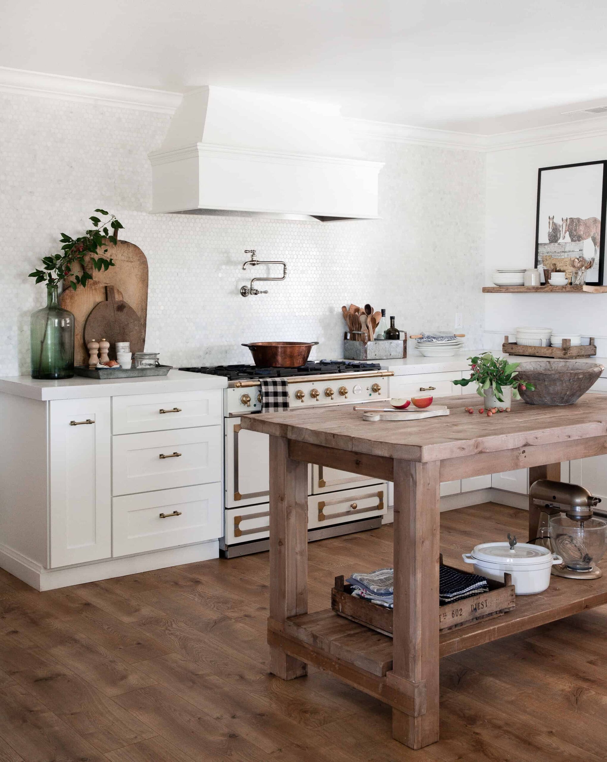 white kitchen with hexagon marble backsplash and rustic wood island and rustic wood accent pieces