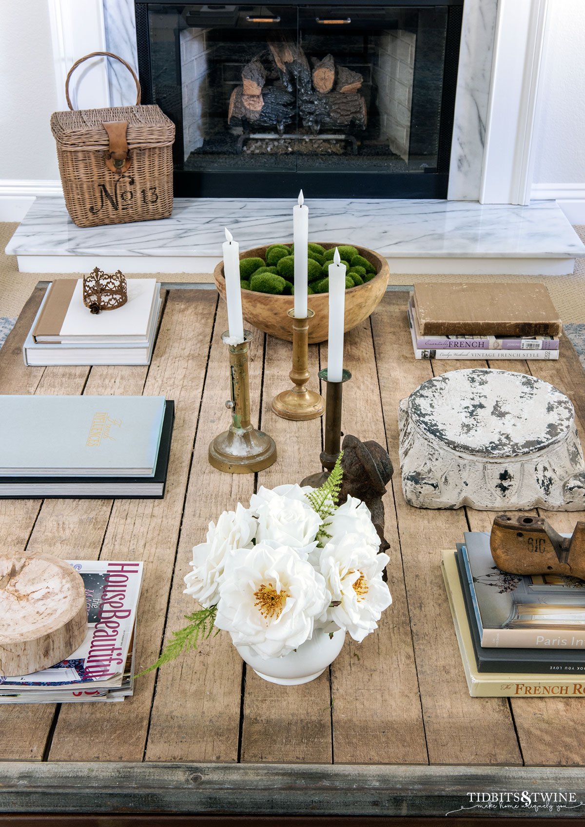 brickmaker's coffee table styled with french candlesticks, roses and books for spring