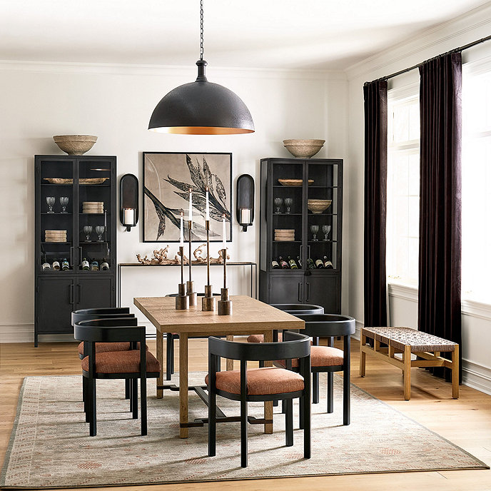 modern dining room with two black cabinets brown table and black chairs and drapes