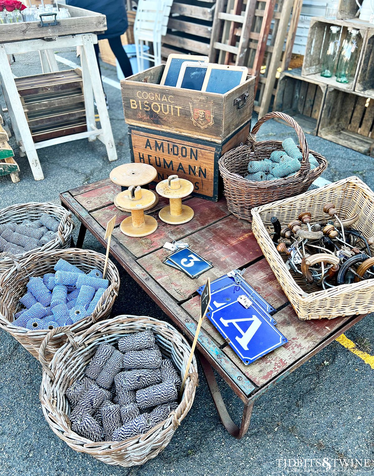 industrial coffee table with baskets of colored twine and european number plates