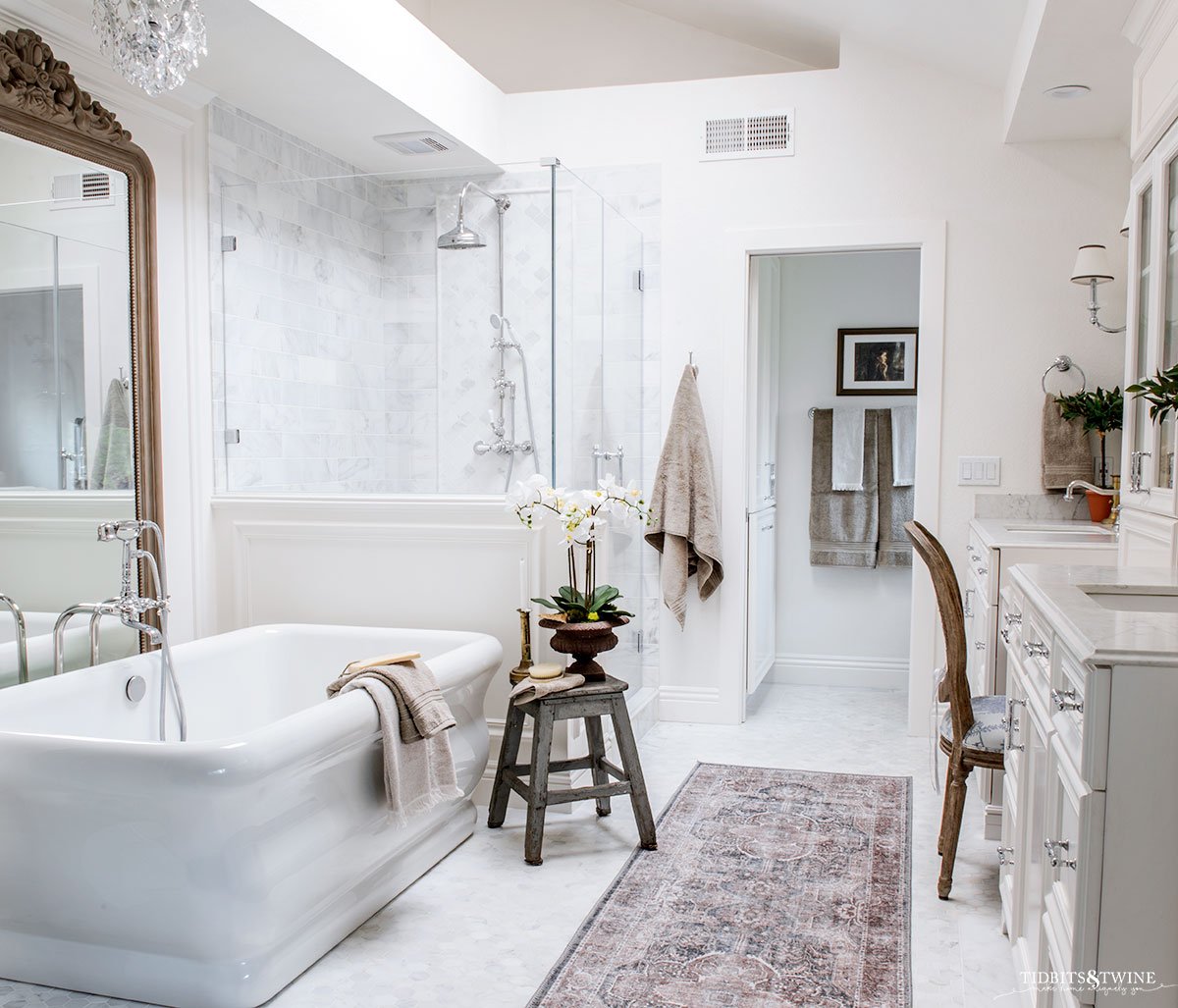 white marble bathroom with freestanding tub
