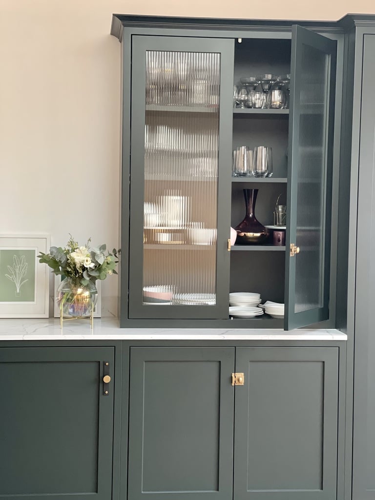 reeded glass inserts in kitchen blue cabinets 