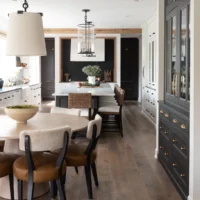 white kitchen with black and wood stained accents and large black display cabinet