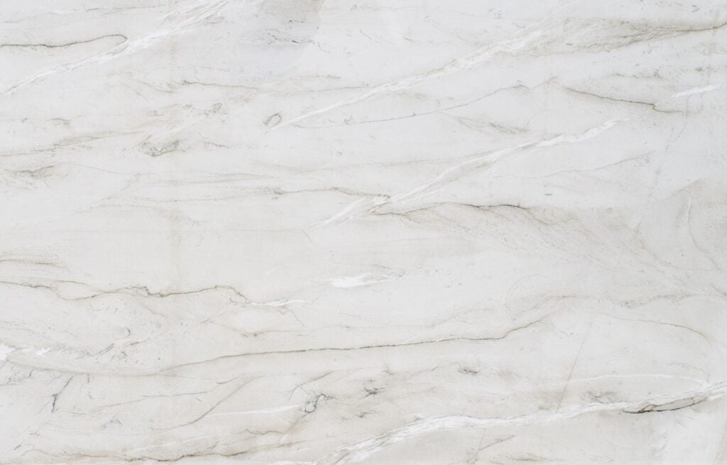 Branco Superiore quartzite slab with creamy background and brown and white veining