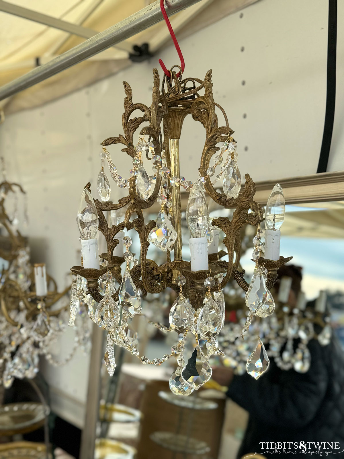 antique french crystal chandelier with brass at an antique fair