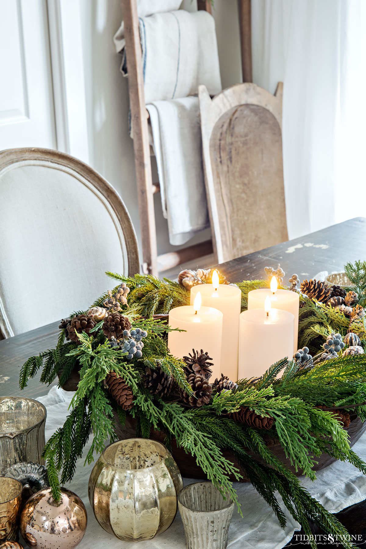french dining room with diy advent wreath on table along with mercury votives and dough bowl in corner