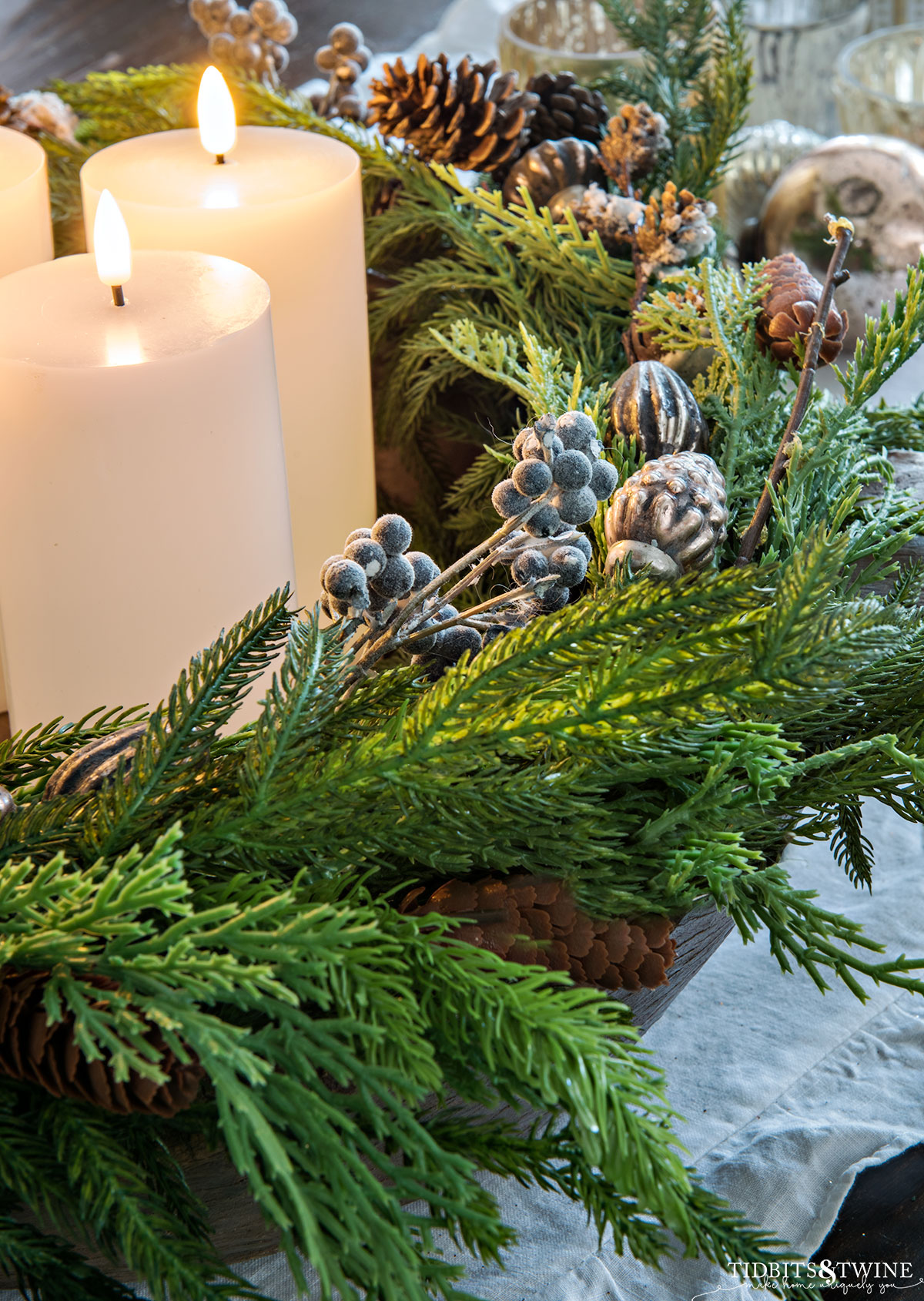 faux greenery and berry diy advent wreath with white led pillar candles