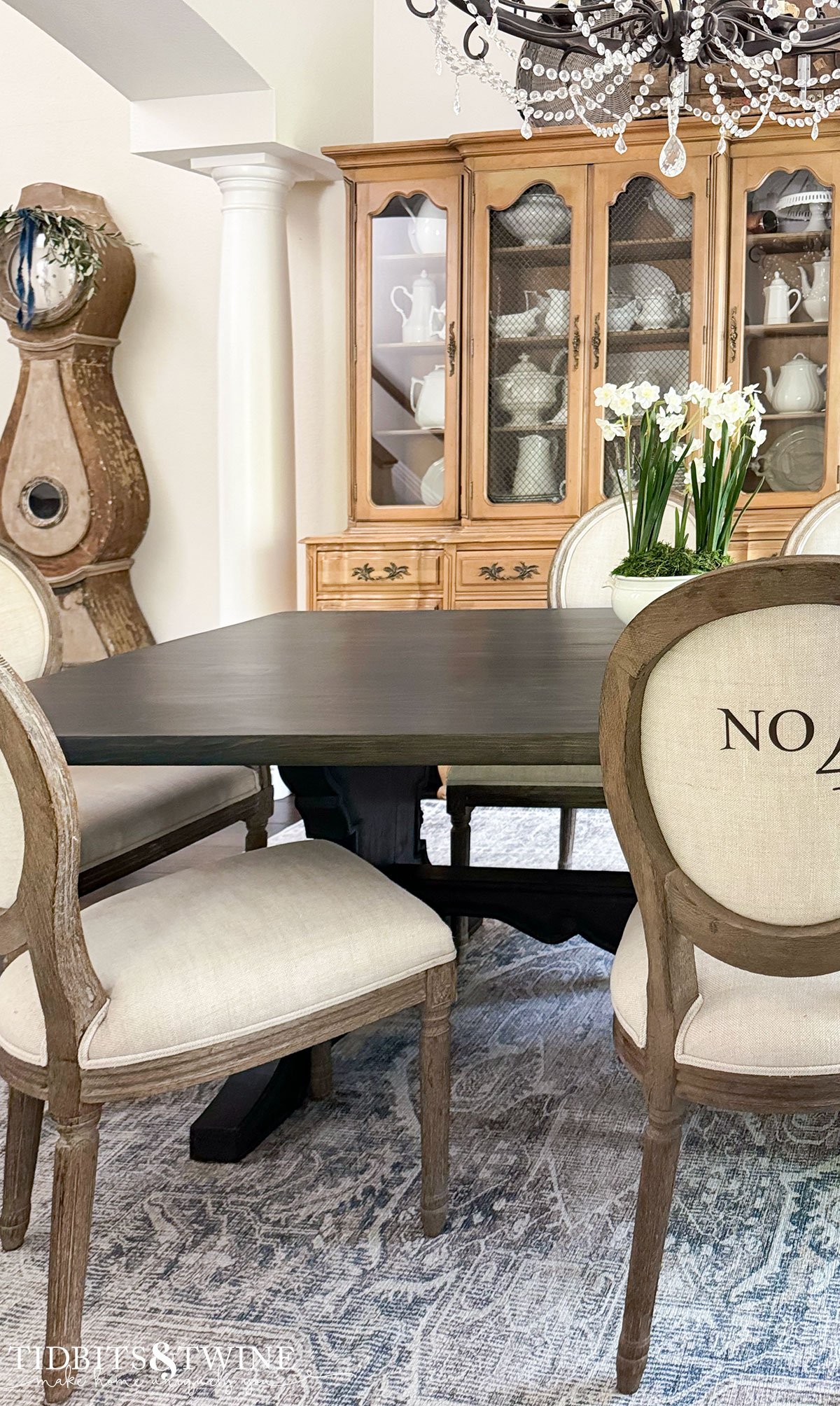 european dining room with swedish mora clock trestle table and numbered chairs