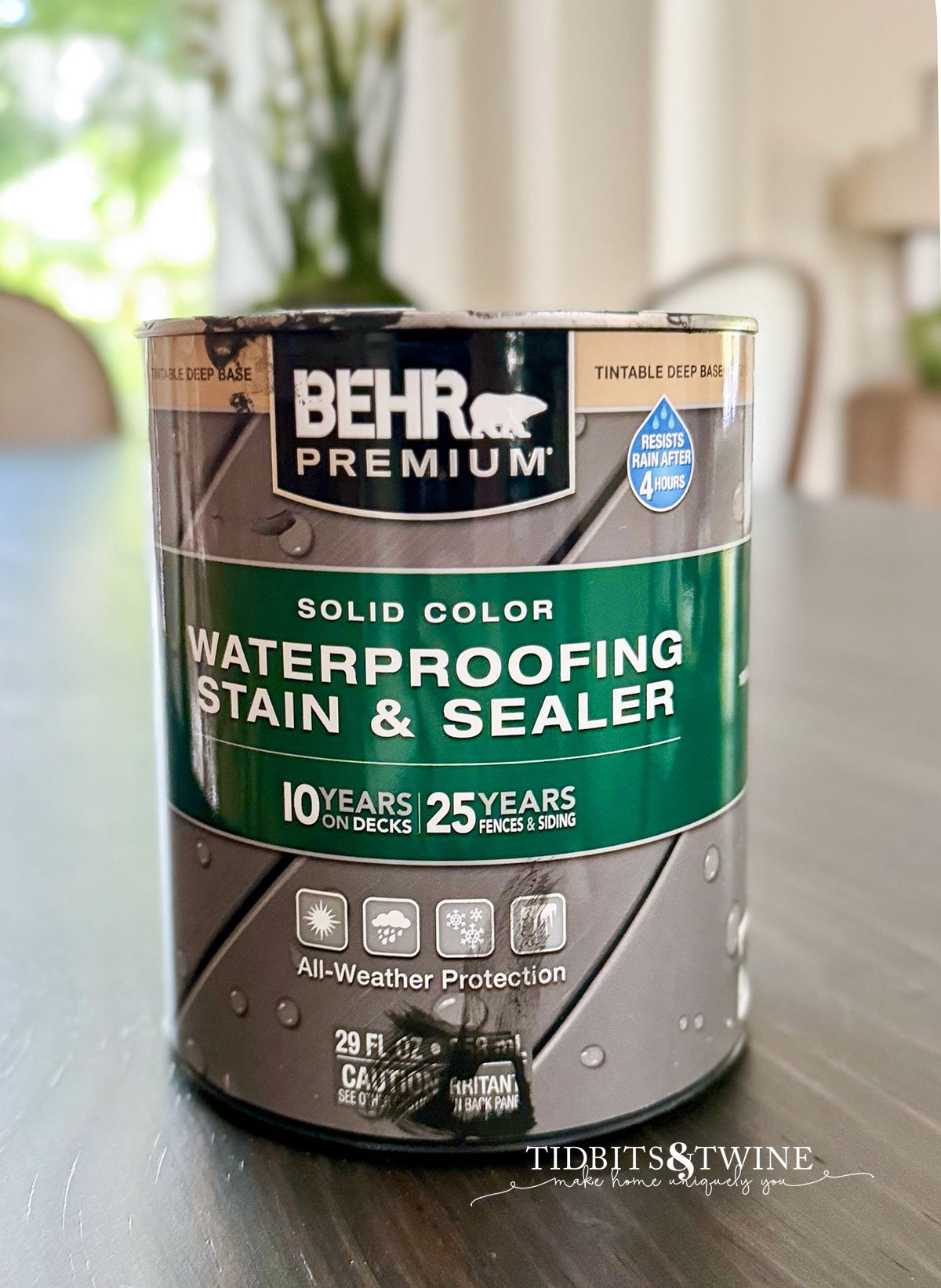 closeup of can of behr solid stain on dining table