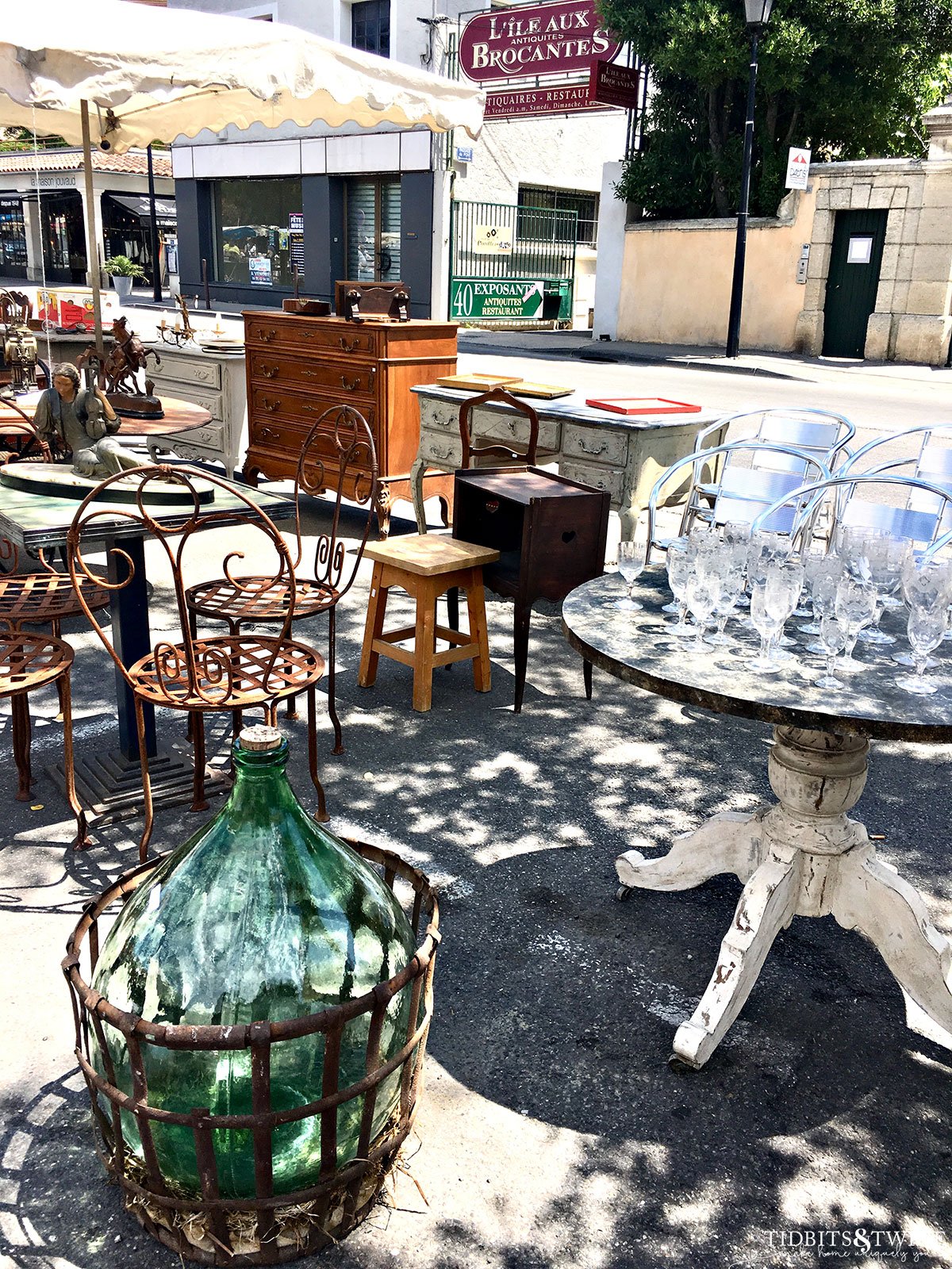 french antique market in Provence with demijohn, furniture and glassware