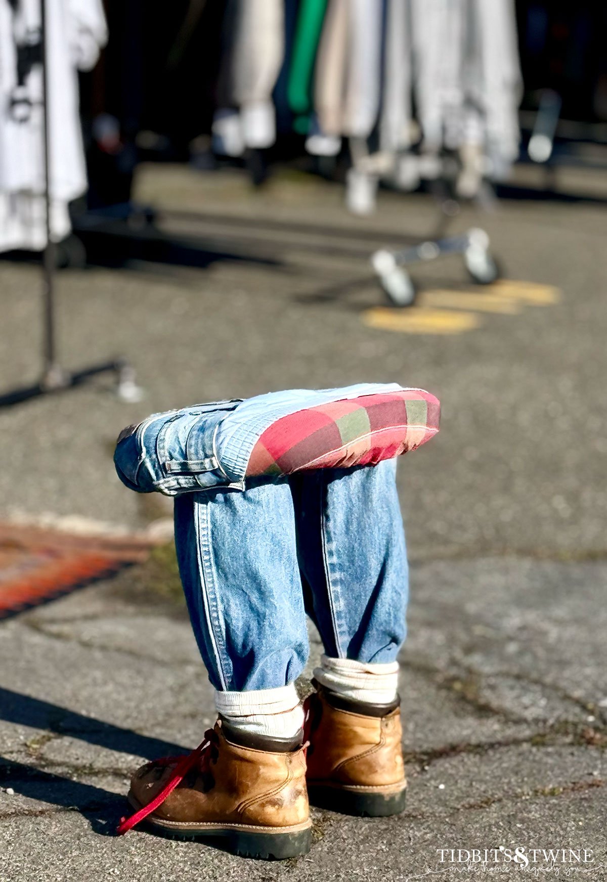 sitting stool with legs wearing jeans and shoes that looks like a person