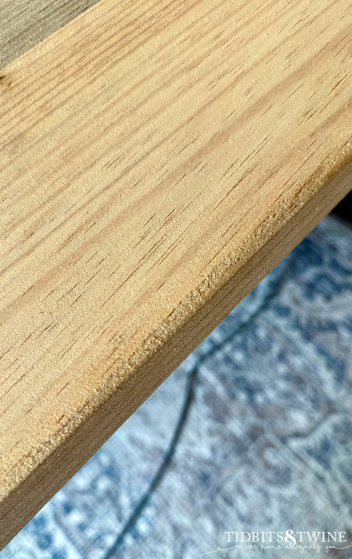 closeup of sanded edge of tabletop showing rough areas