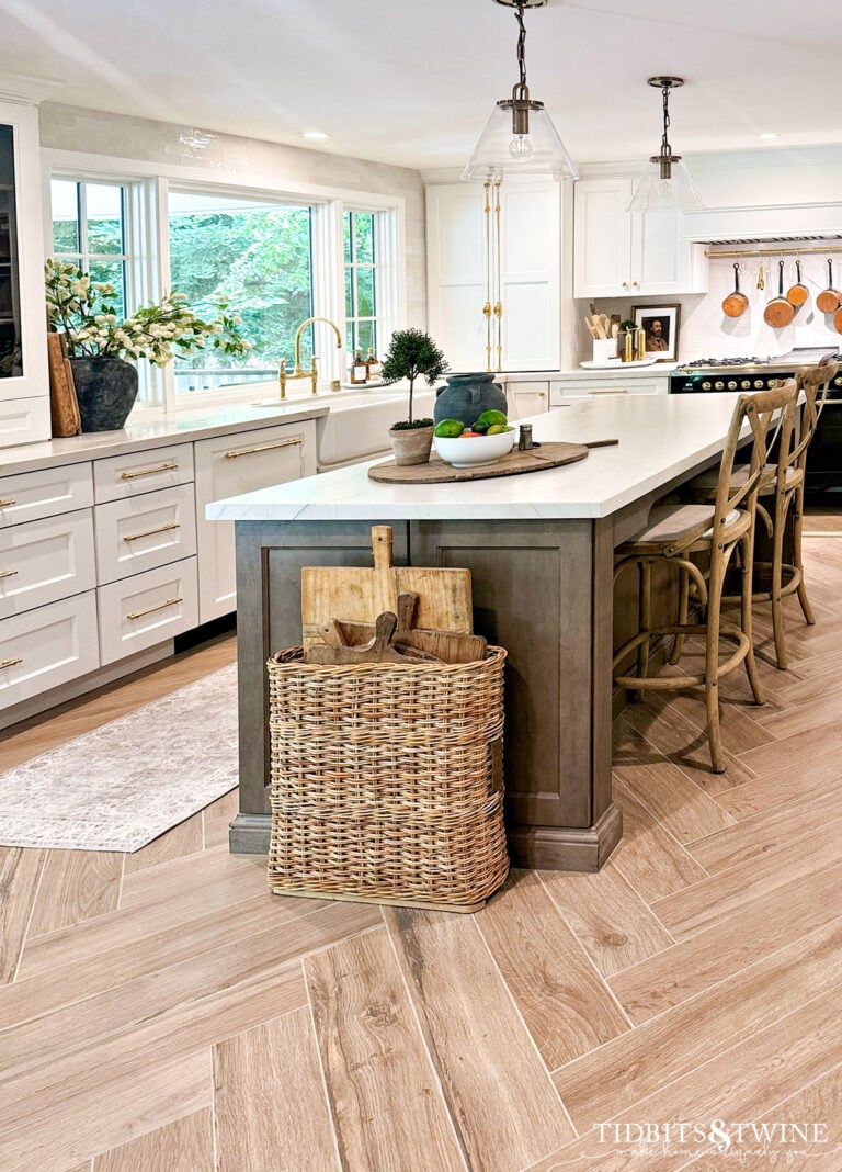 warm white kitchen with quartzite countertops and herringbone floor