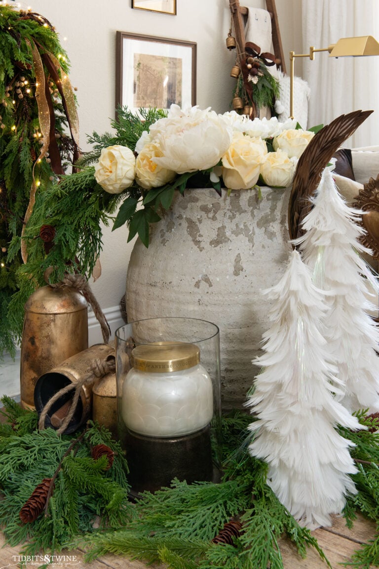 french christmas decor on a coffee table with white flowers and white feather trees