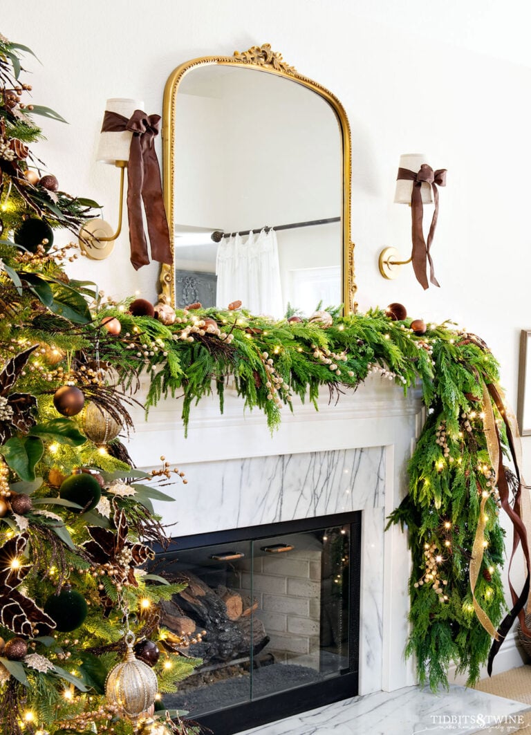 French inspired Christmas garland idea on fireplace mantel with brown and gold accents