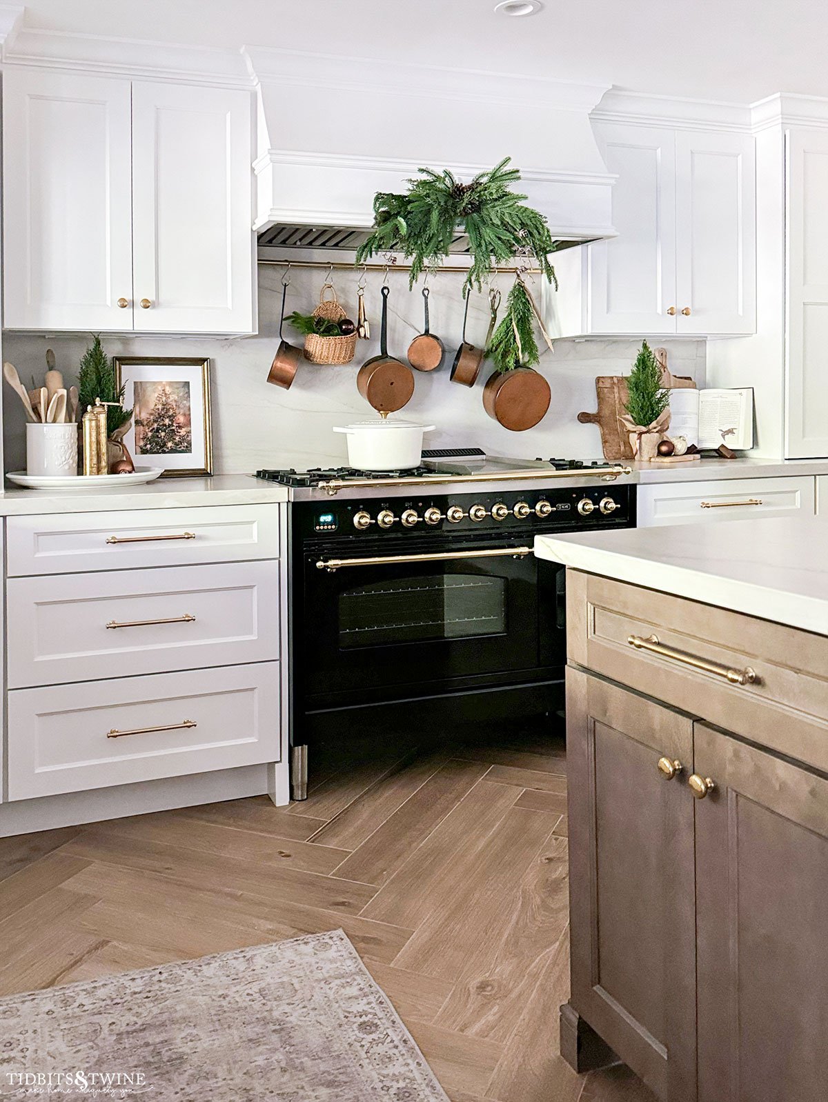 traditional kitchen with black ilve stove range decorated for christmas with greenery