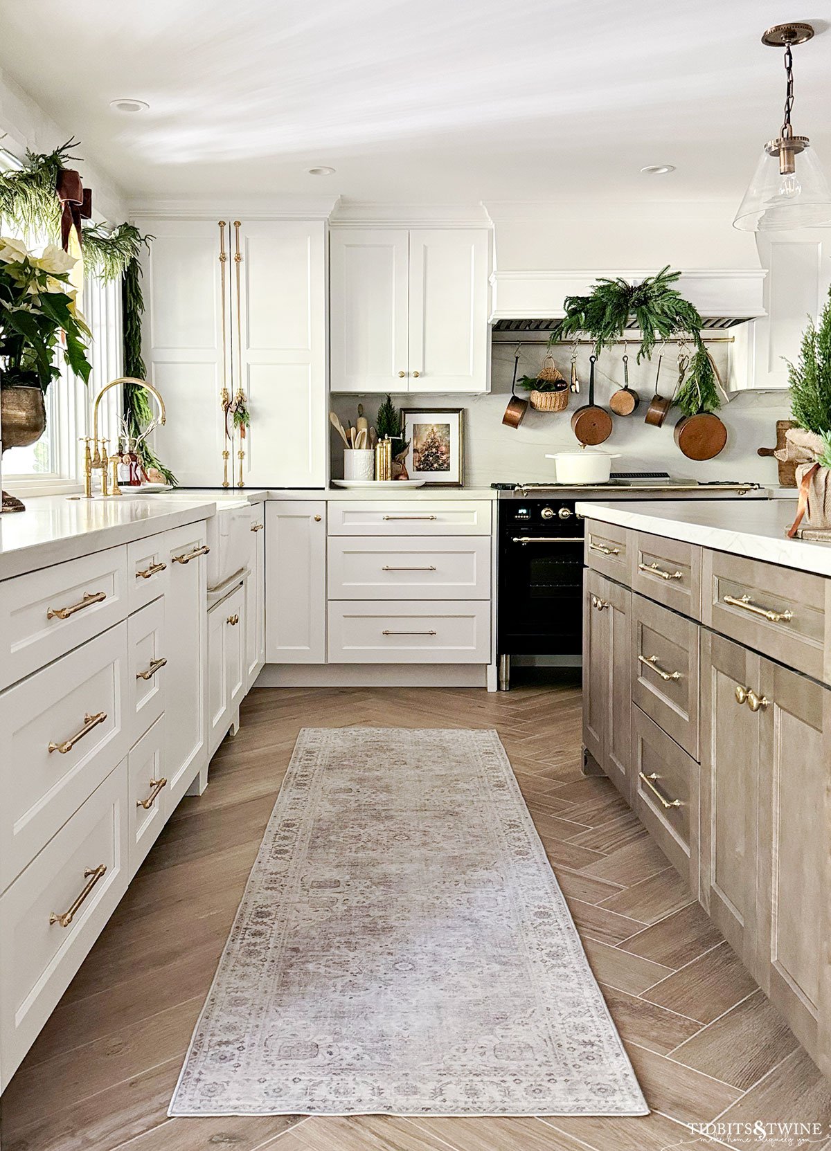 french-inspired kitchen with white cabinets and wood island decorated for christmas - Christmas kitchen ideas