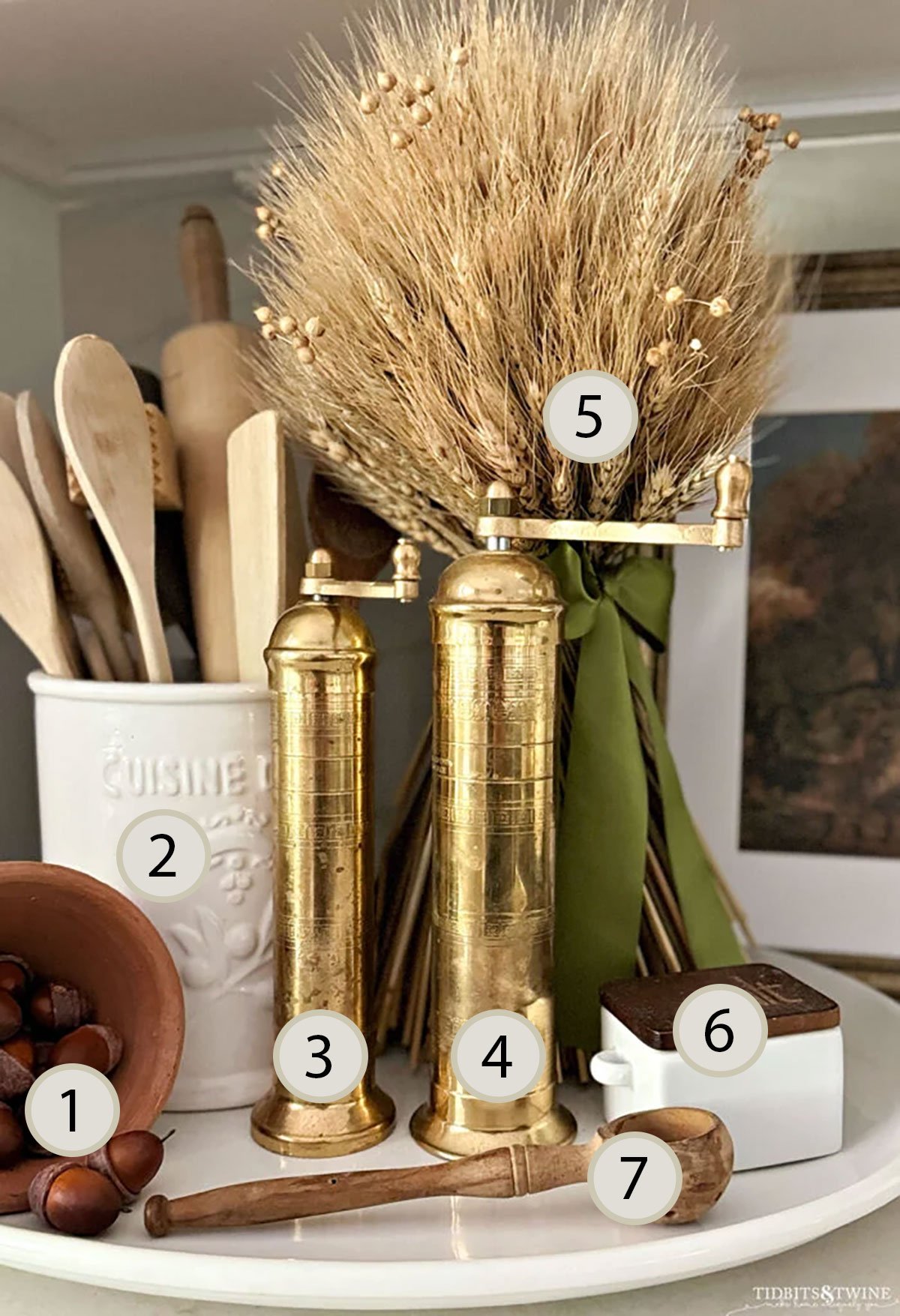 Fall kitchen counter vignette styled using the rule of odds interior design with five decorative items